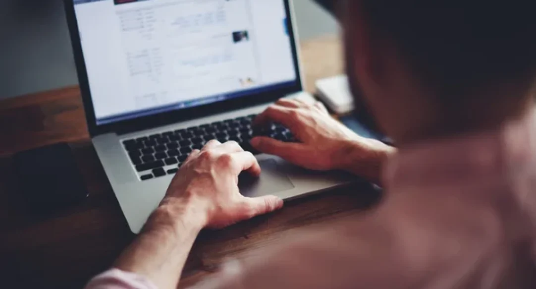 depositphotos_69202465-stock-photo-man-working-on-his-laptop