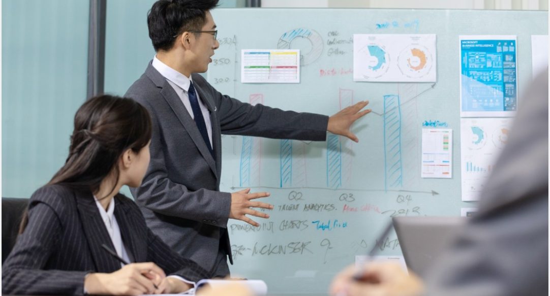 group-people-working-out-business-plan-office (1)
